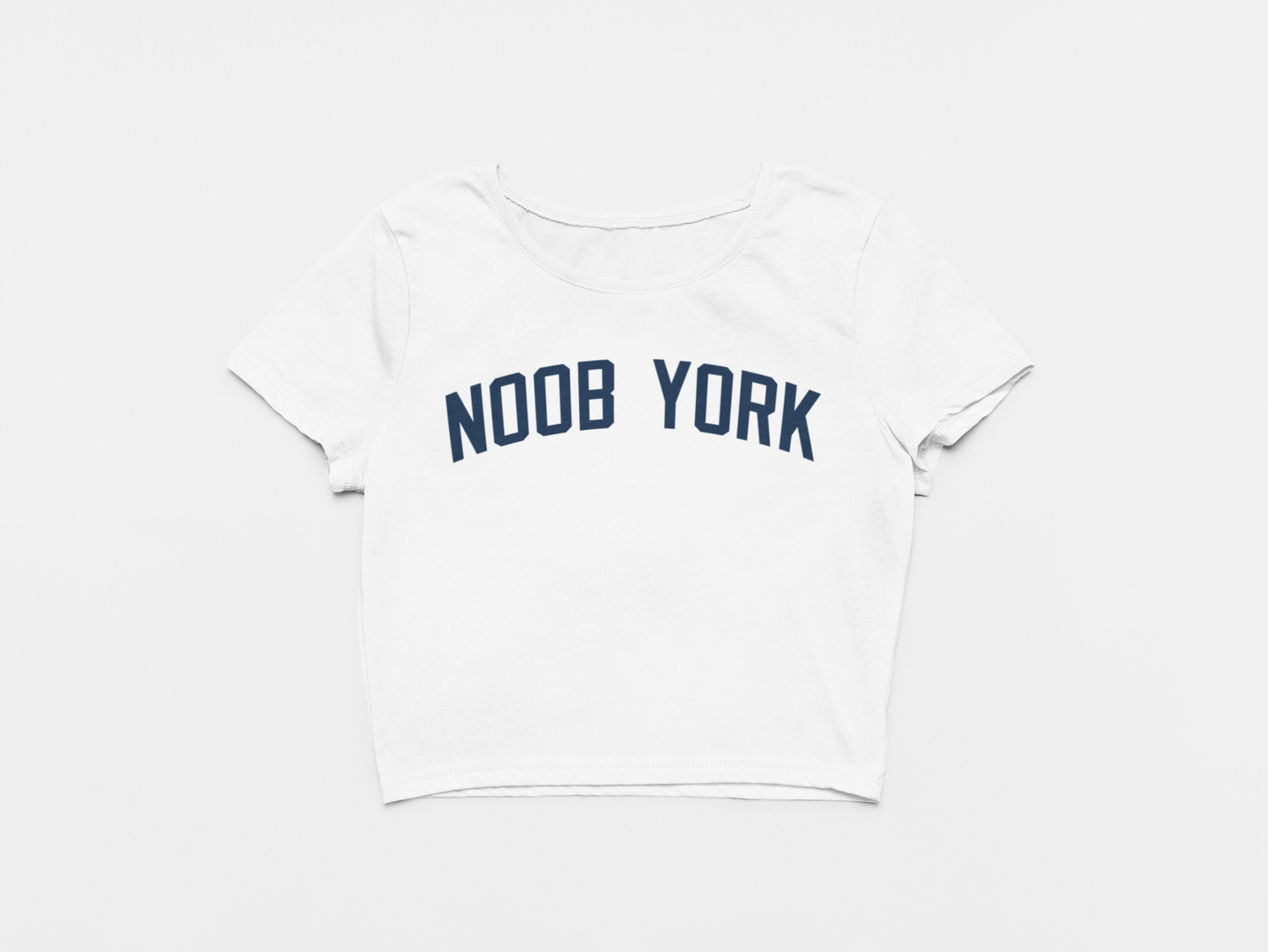white crop top, front of crop top, navy lettering, noob york across the chest, new york yankees, yankees font, yankees