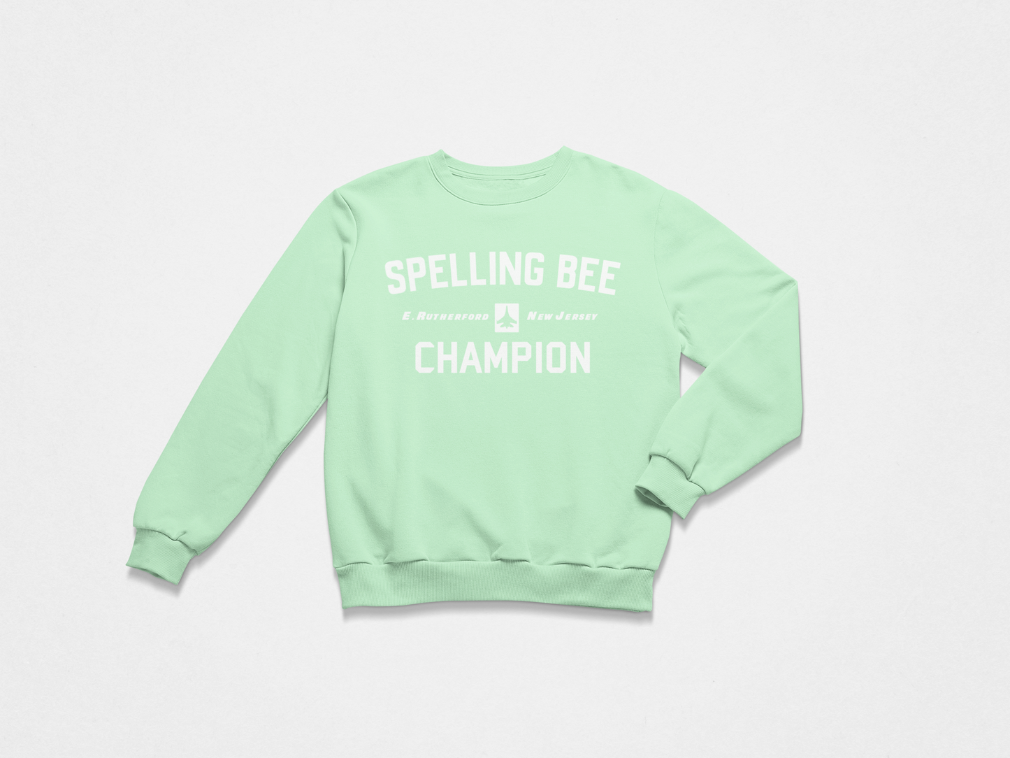 light green sweatshirt, crewneck, front of crewneck, white lettering, spelling bee champion, east rutherford new jersey, new york jets, jets,