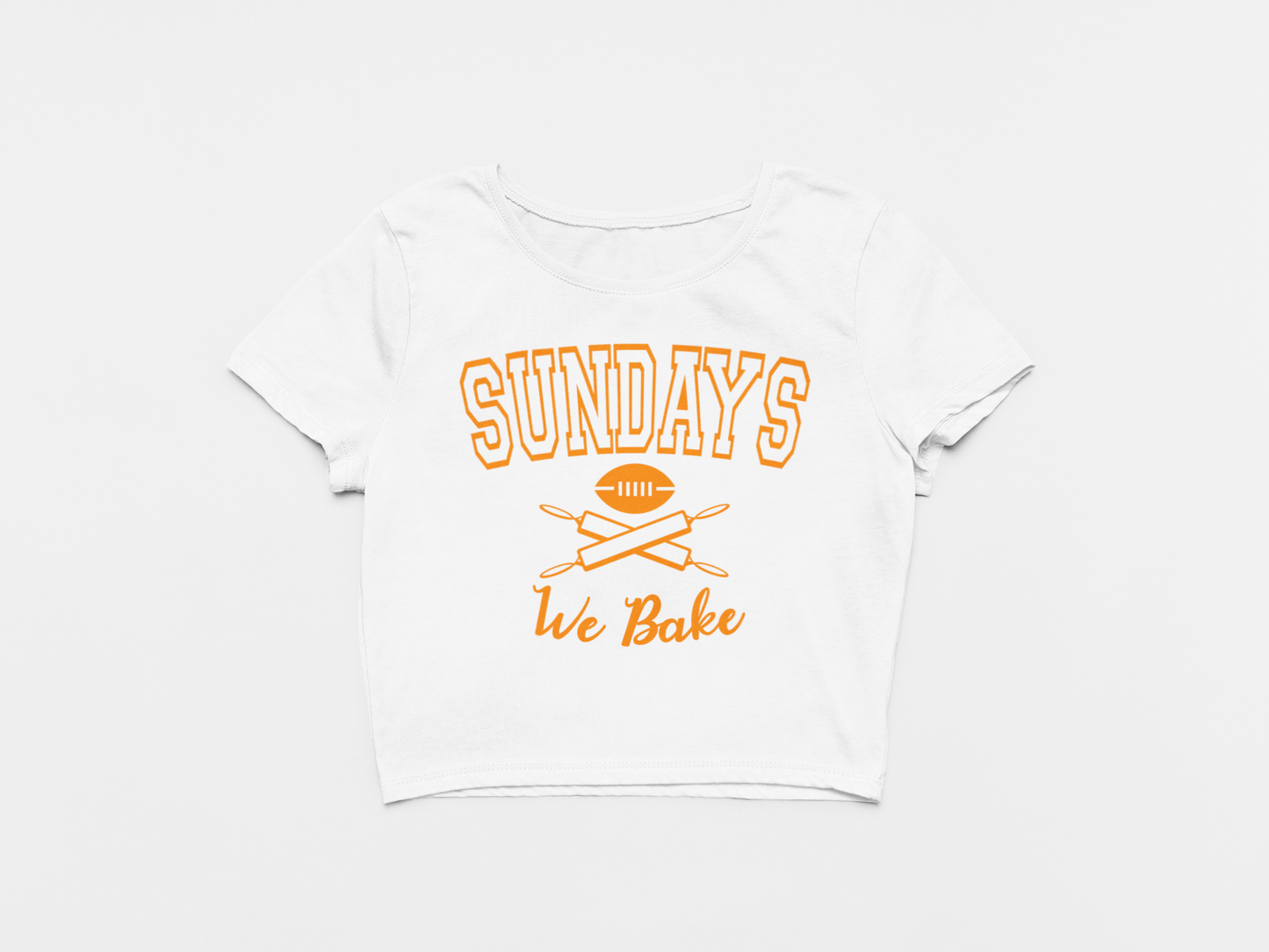 white crop top, front of crop top, creamsicle lettering, orange lettering, sundays we bake, baker mayfield, football and rolling pins, tampa bay buccaneers, bucs