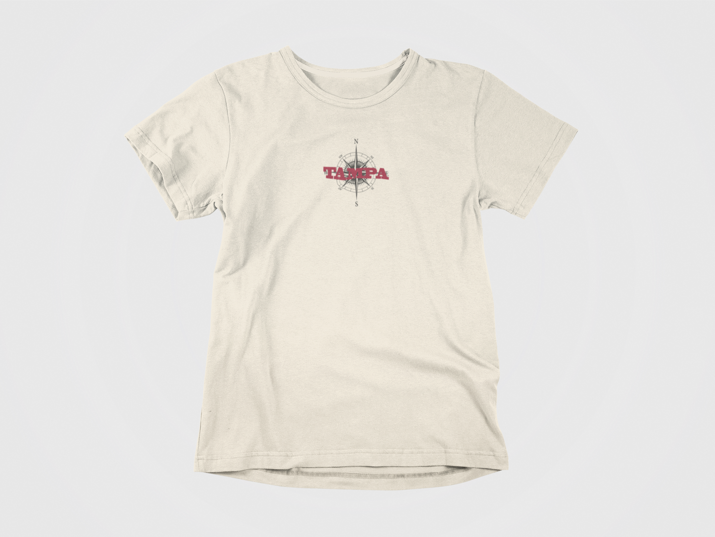 front of shirt, tampa written over a compass, red lettering, logo centered, tampa bay buccaneers, tampa