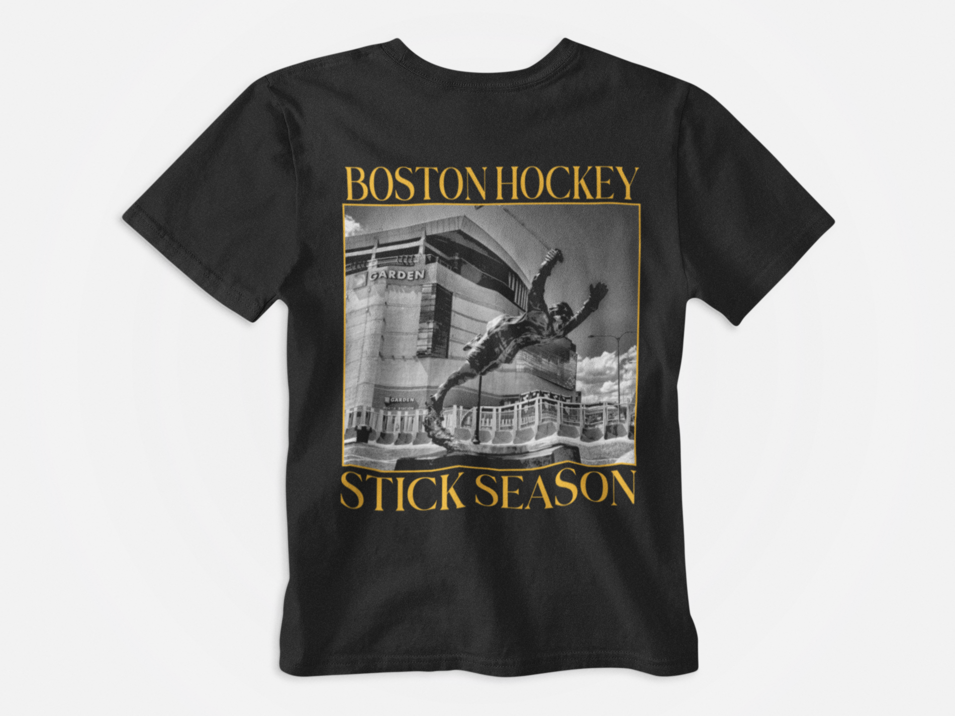 back of shirt, color black, yellow lettering, boston hockey stick season, black and white photo of td gardens and bobby orr, noah kahn inspired, boston bruins