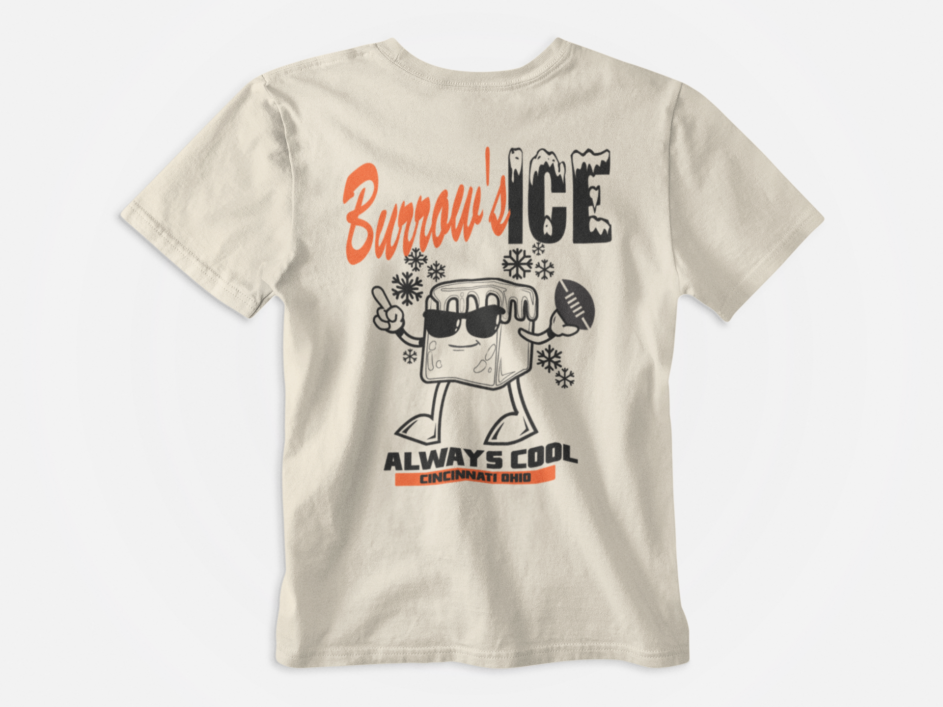 Cream Colored Shirt, Back of Shirt, Top Font Burrow's Ice, Bottom Font Always Cool Cincinnati Ohio, Joe Burrow, Cincinnati Bengals, Picture of an Ice Cube with glasses throwing a football and snowflakes