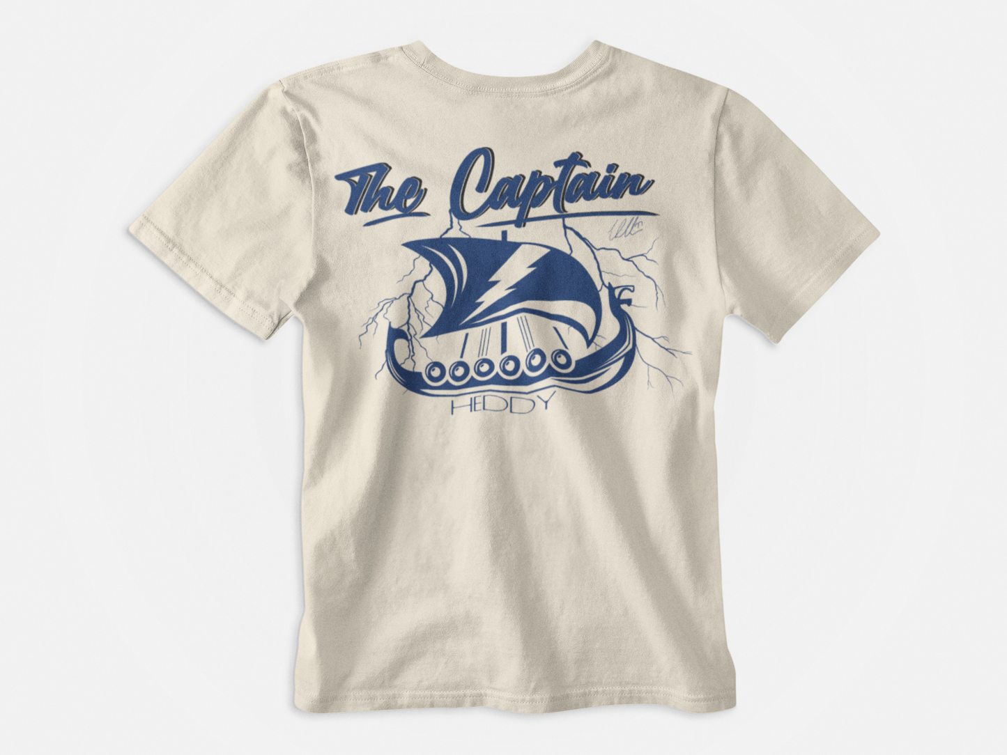 Back of Shirt, Cream colored, The captain written at the stop in cursive an Heddy at the bottom, Viking ship with lightning bolts, Lightning bolt banner, Victor Hedman, Tampa Bay Lightning