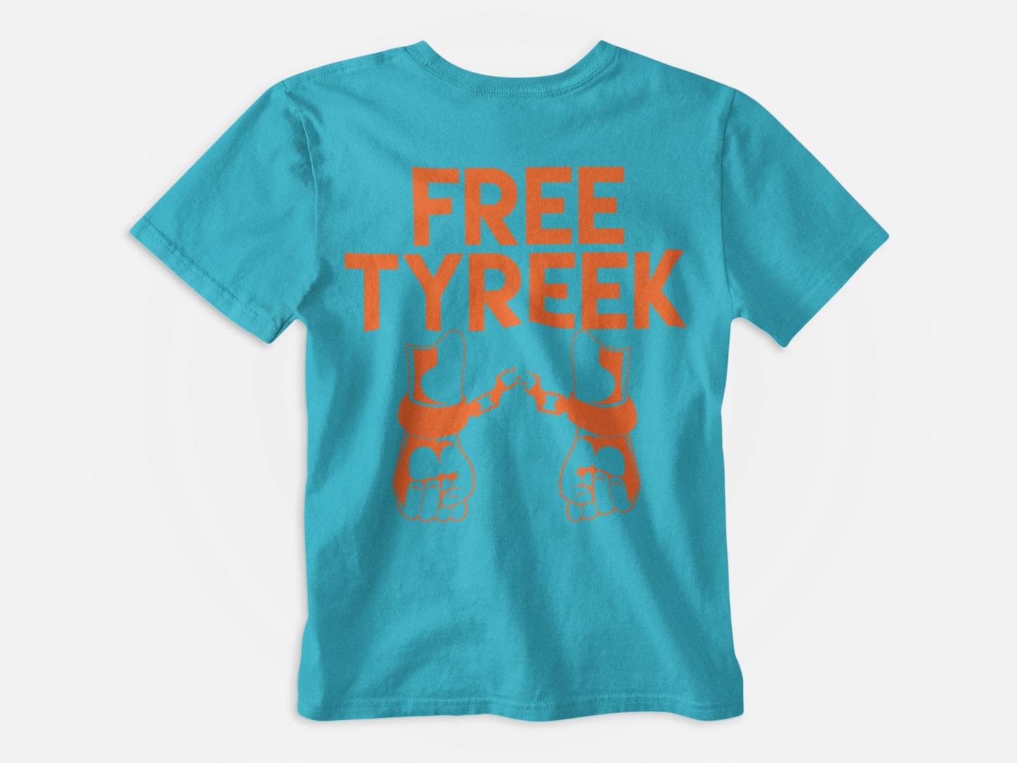 Teal colored shirt, back of shirt, orange handcuffs, free tyreek, hands in handcuffs, miami dolphins, fins