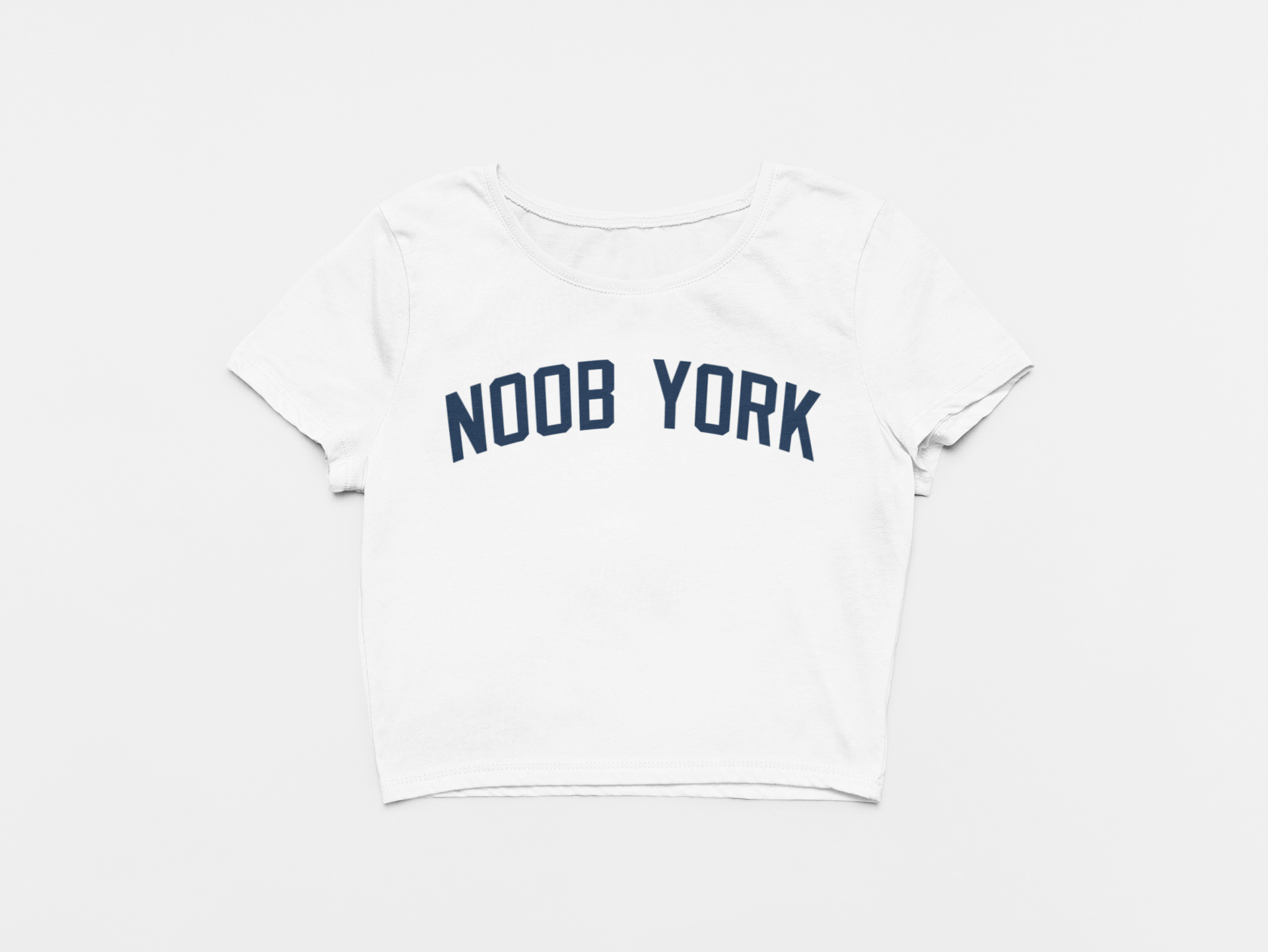 white crop top, front of crop top, navy lettering, noob york across the chest, new york yankees, yankees font, yankees