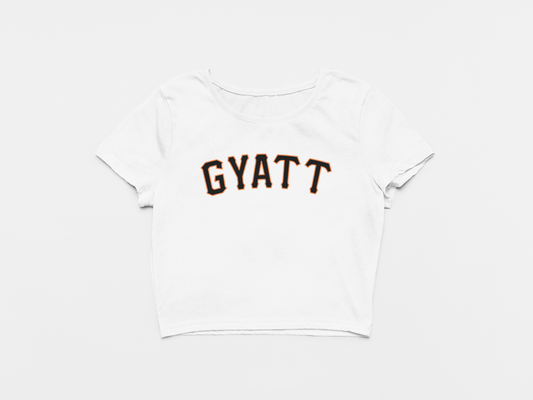 white crop top, front of crop top, gyatt across the chest, giants font, san francisco giants, black and orange lettering, giants