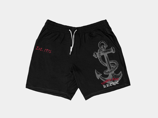 Black shorts, front of shorts, athletic shorts, just below right pocket it says est. 1976, left side of shorts has a grey anchor and says Tampa Bay in red and is arced and belowe it says KREWE in white in old english font