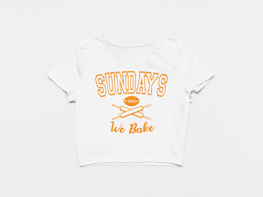 white crop top, front of crop top, creamsicle lettering, orange lettering, sundays we bake, baker mayfield, football and rolling pins, tampa bay buccaneers, bucs