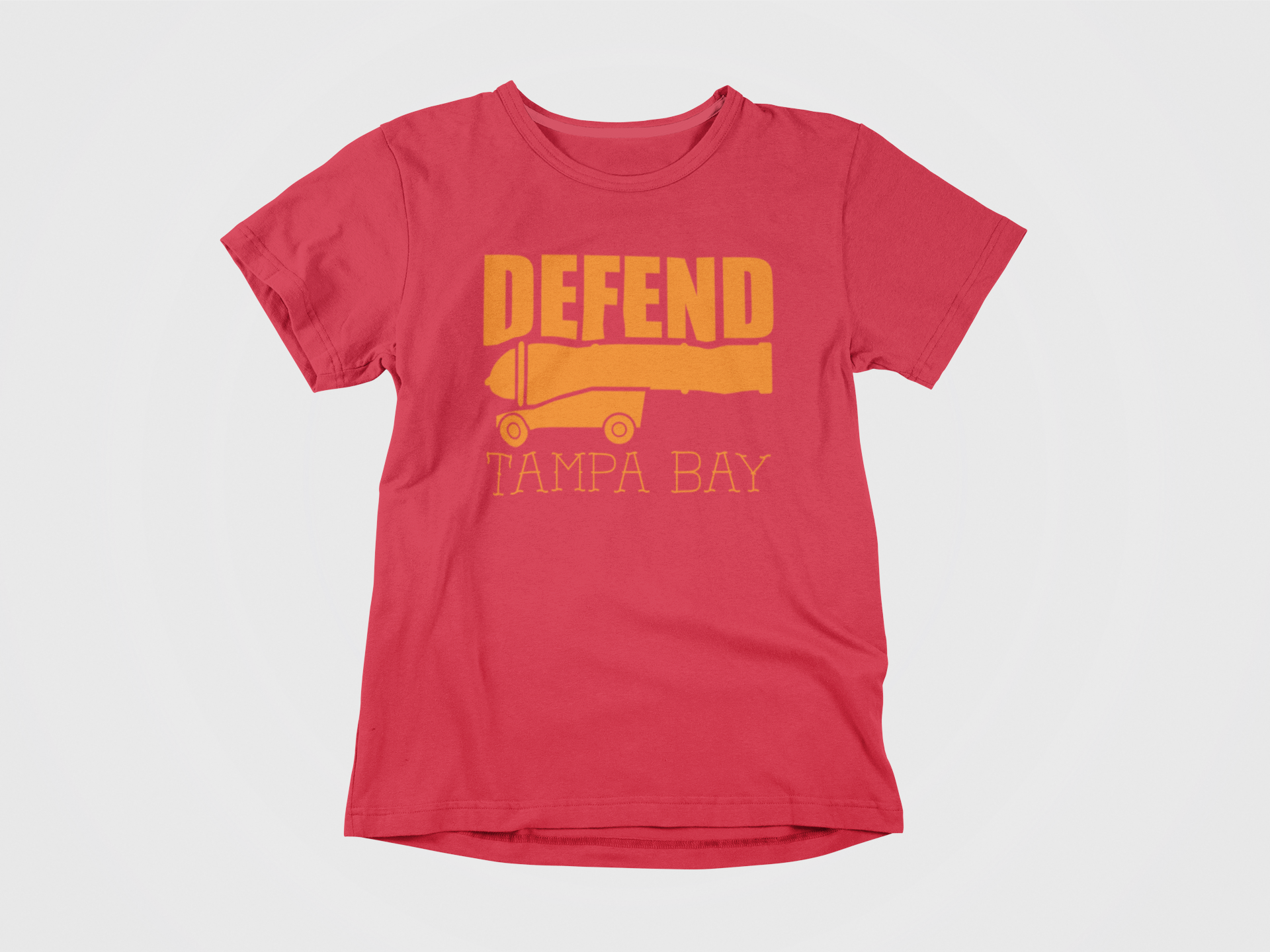 front of shirt, red shirt, orange lettering, defend tampa bay, cannon, tampa bay buccaneers, bucs