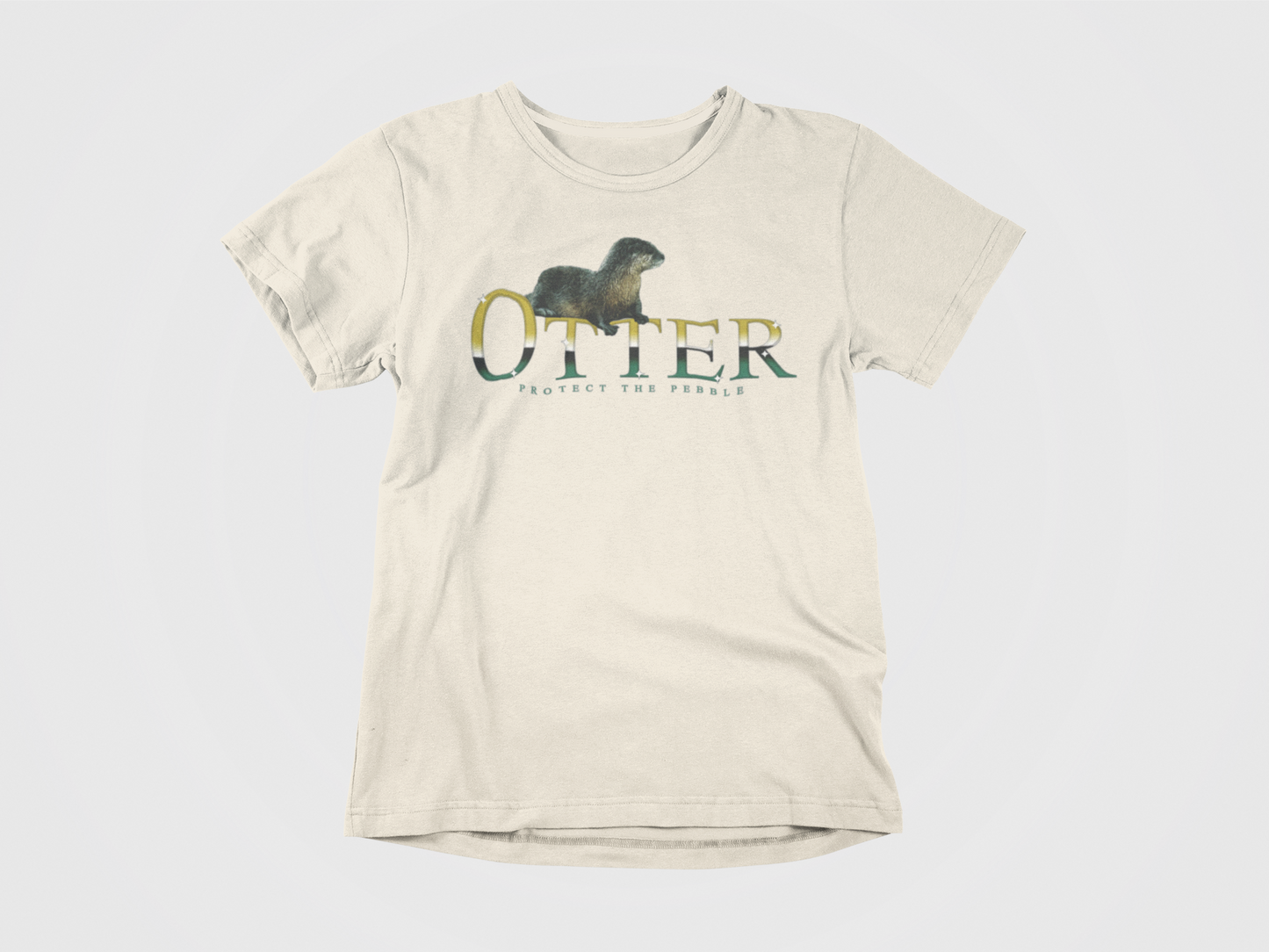 front of shirt, cream colored, otter across the chest, gradient font, protect the pebble, picture of otter, dallas stars