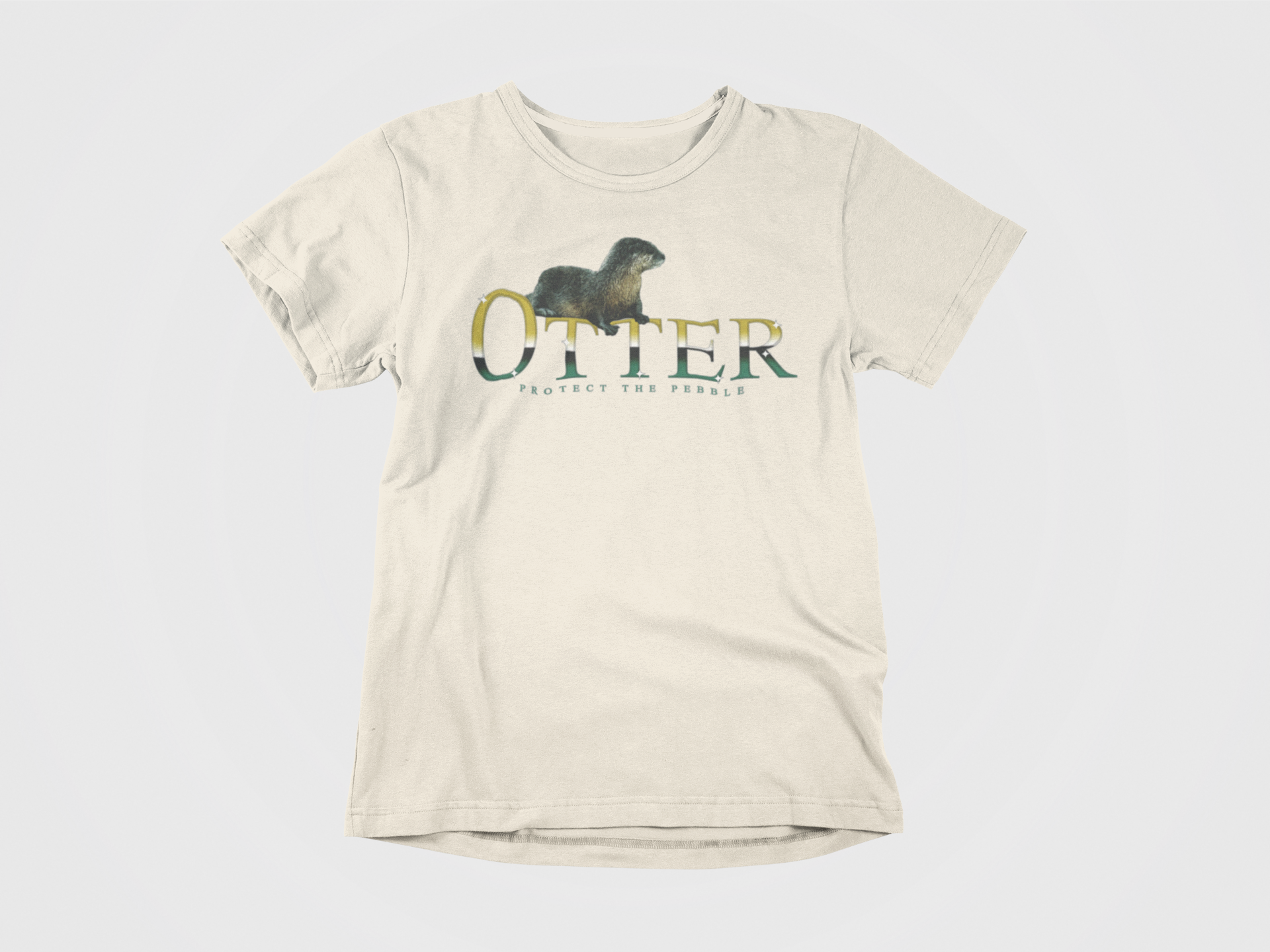 front of shirt, cream colored, otter across the chest, gradient font, protect the pebble, picture of otter, dallas stars